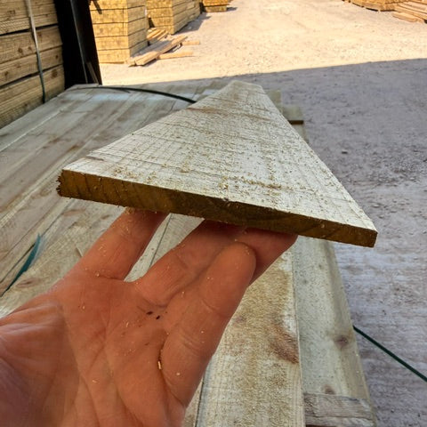 Feather edge board for fencing and panels treated